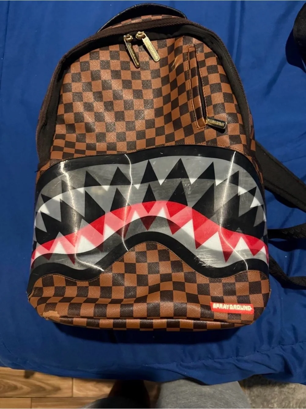 Sprayground Brown Checkered Shark Mouth Backpack with Red Accents